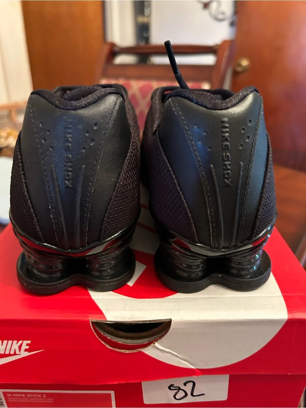 Nike Women’s Black Athletic Shoes with Red Accents